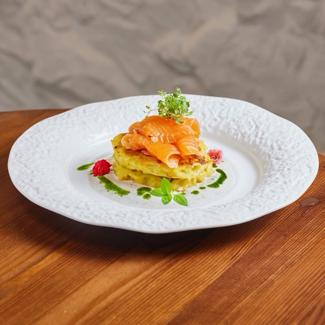 Potato hash brown with salmon and smoked sour cream